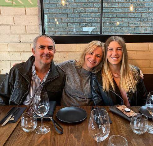 Ellen Perez with her parents.